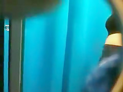 Dressing room spycam shows a sexy brunette changing into a